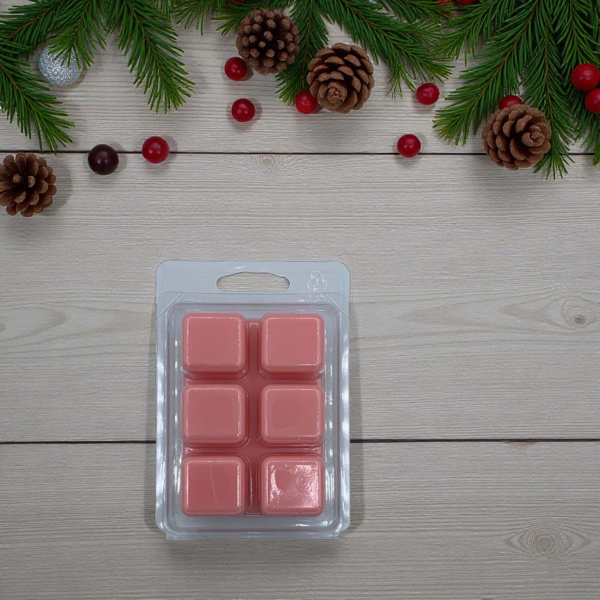 Waxmelt Christmas Fair limited edition waxmelt pack with pink cubes on a festive background.