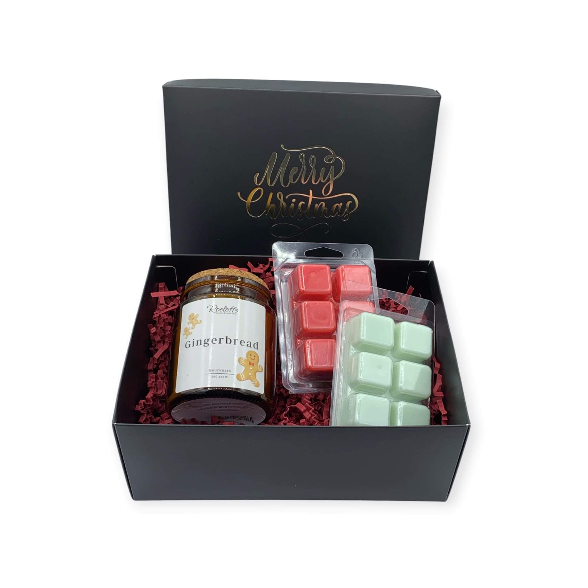 Kerstcadeau met geurkaars en waxmelts in warme kerstgeuren, perfect voor de feestdagen.